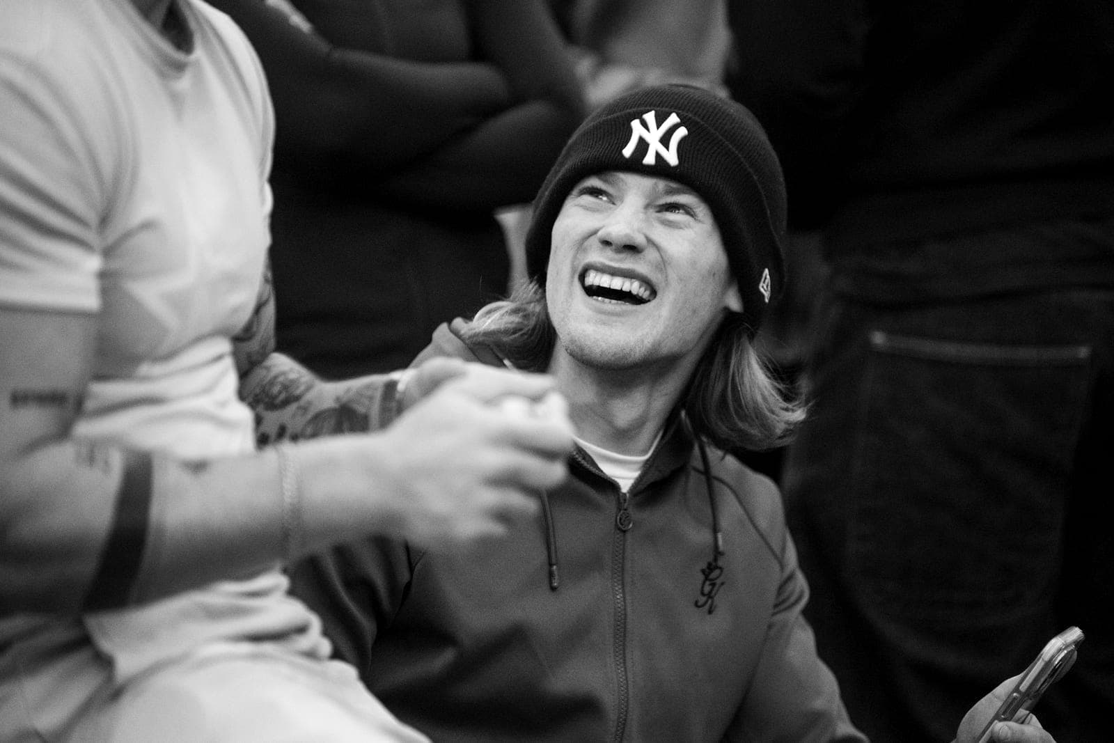 A candid moment at OTA’s First Serve event, from the project’s community photography